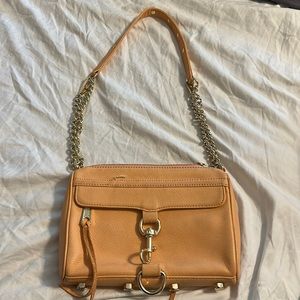 Peach colored Rebecca Minkoff purse.